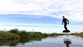 Hydrofoil rider gliding over the water Royalty Free Stock Photo