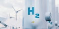 Hydrogen energy storage gas tank with solar panels and wind turbine in background. Royalty Free Stock Photo