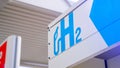 Hydrogen logo on gas station. h2 combustion engine for emission free ecofriendly transport Royalty Free Stock Photo