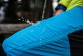 Hydrophobic effect on blue waterproof fabric on mountain trousers.