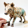 Hyena Paper Sculpture: Playful Visual Puzzles In Light Brown And Teal