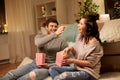 Happy couple eating popcorn at home Royalty Free Stock Photo