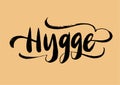 Hygge lettering. Mean: coziness. Brush pen modern style. Danish happy life style concept. Hand drawn calligraphy inscription