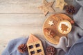 Hygge Scandinavian style concept with coffee cup and eco friendly decorations on wooden background. Cozy winter Christmas top view