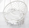 Hygge scene with hammock chair on white background. Cozy place for weekend relax in the room
