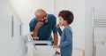 Hygiene, bathroom and father brushing teeth with child for oral health and wellness at home. Bonding, happy and young Royalty Free Stock Photo
