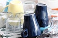 dishes, cups and glasses washed and placed to dry on the sink