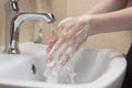 Hygiene. Cleaning Hands. Washing hands with soap. Woman`s hand with foam. Protect yourself from coronavirus COVID-19 Royalty Free Stock Photo