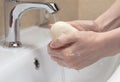 Hygiene. Cleaning Hands. Washing hands with soap. Woman`s hand with foam. Protect yourself from coronavirus COVID-19 pandemia Royalty Free Stock Photo