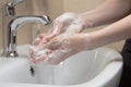 Hygiene. Cleaning Hands. Washing hands with soap. Woman`s hand with foam. Protect yourself from coronavirus COVID-19 pandemia. Royalty Free Stock Photo