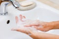 Hygiene concept. Washing hands with soap under the faucet with water Royalty Free Stock Photo