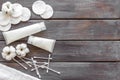 Hygiene cotton swabs, pads and cream for pattern on wooden background top view mock up Royalty Free Stock Photo