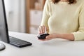 Close up of woman cleaning computer mouse Royalty Free Stock Photo