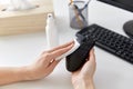 Close up of woman cleaning computer mouse