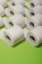 Toilet paper concept on green background. Hygiene and health. Co