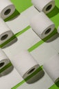 Toilet paper concept on green background. Hygiene and health. Co