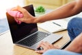 Hygiene, laptop and closeup of man cleaning his screen to prevent dust, dirt or germs at his desk. Technology, health Royalty Free Stock Photo