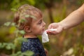 Cleaning baby face and skin with wet wipes Royalty Free Stock Photo