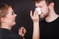 Woman wipe man face by hygienic tissue.