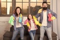 Hygiene. We will make your world spotless. Family clean house. Happy family hold cleaning products. Mother, father and Royalty Free Stock Photo