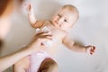 Hygiene - young momy wiping the baby skin with wet wipes. Cleaning wipe, pure, clean Royalty Free Stock Photo