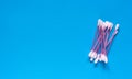 Hygienic cotton swabs on a blue background