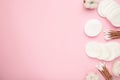 Hygienic disposable product cosmetic pads and cotton flower on pink background Royalty Free Stock Photo