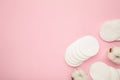 Hygienic disposable product cosmetic pads and cotton flower on pink background Royalty Free Stock Photo