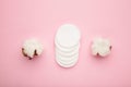 Hygienic disposable product cosmetic pads and cotton flower on pink background Royalty Free Stock Photo