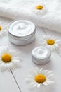 Hygienic herbal cosmetic cream with chamomile vitamin spa lotion Royalty Free Stock Photo