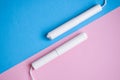 Hygienic tampons on a blue and pink background. copy space, Menstruation sanitary tampon for woman hygiene protection. Critical Royalty Free Stock Photo