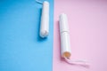 Hygienic tampons on a blue and pink background. copy space, Menstruation sanitary tampon for woman hygiene protection. Critical Royalty Free Stock Photo