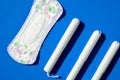 Hygienic tampons and sanitary pad on a blue background. copy space, Menstruation woman hygiene protection. Critical days. Medical Royalty Free Stock Photo