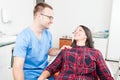 Hygienist holding patient as being trustworthy