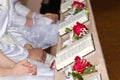 The hymn books with red roses at desk