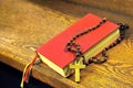 Hymnal book and wooden rosary bead Royalty Free Stock Photo