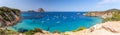 Hyper panorama of Cala Hort with sea sailing yachts and the mountain Es Vedra. Ibiza, Balearic Islands, Spain