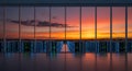 Hyper-realistic photo: Illuminated network servers in a massive data center with a panoramic view of a vibrant orange purple sunse Royalty Free Stock Photo