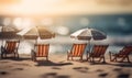 Tiny deck chairs and umbrellas on the beach