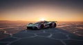 Hypercar glows under a vibrant desert sunset Royalty Free Stock Photo