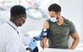 Hypertension happens, regular screening helps. a doctor examining a young man with a blood pressure gauge.