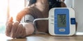 Hypertension or high blood pressure illness in patient with blood pressure monitoring, measurement on digital sphygmomanometer
