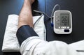 Hypertensive patient performing a blood pressure auto test Royalty Free Stock Photo