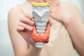 Hyperthyroidism, Overactive Thyroid, Thyroid Lymphoma, Asian woman with thyroid gland human anatomy model Royalty Free Stock Photo
