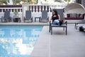 Hypochondriac Female Tourist Disgusted at Pool Royalty Free Stock Photo