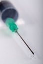 Hypodermic Needle with Droplet Royalty Free Stock Photo