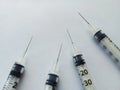 Hypodermic needles on white background