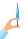 Hypodermic syringe in doctor hand