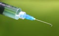 Hypodermic syringe falling herbal drop