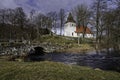 Hyssna old church just by the river. Sweden. Royalty Free Stock Photo